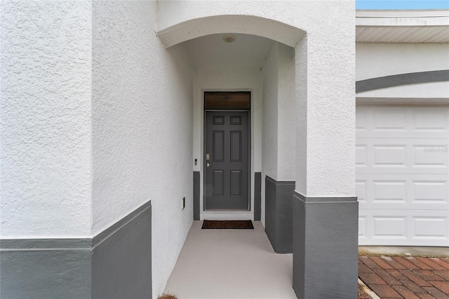 entrance to property featuring a garage