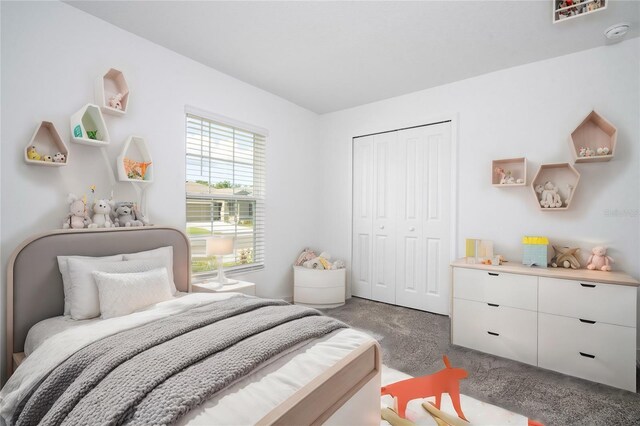 bedroom with a closet and carpet floors