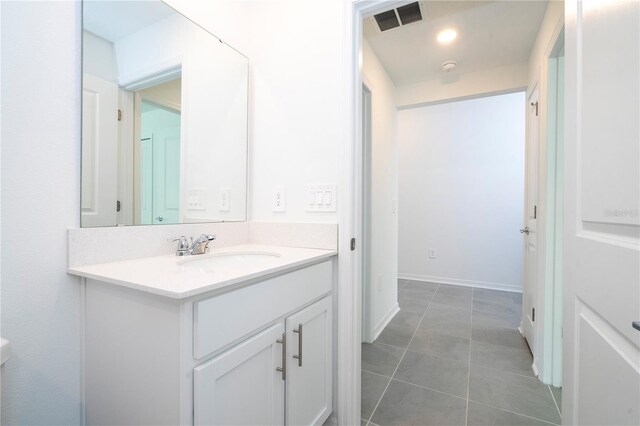 bathroom with vanity and tile patterned flooring