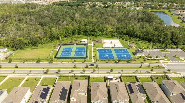 birds eye view of property with a water view