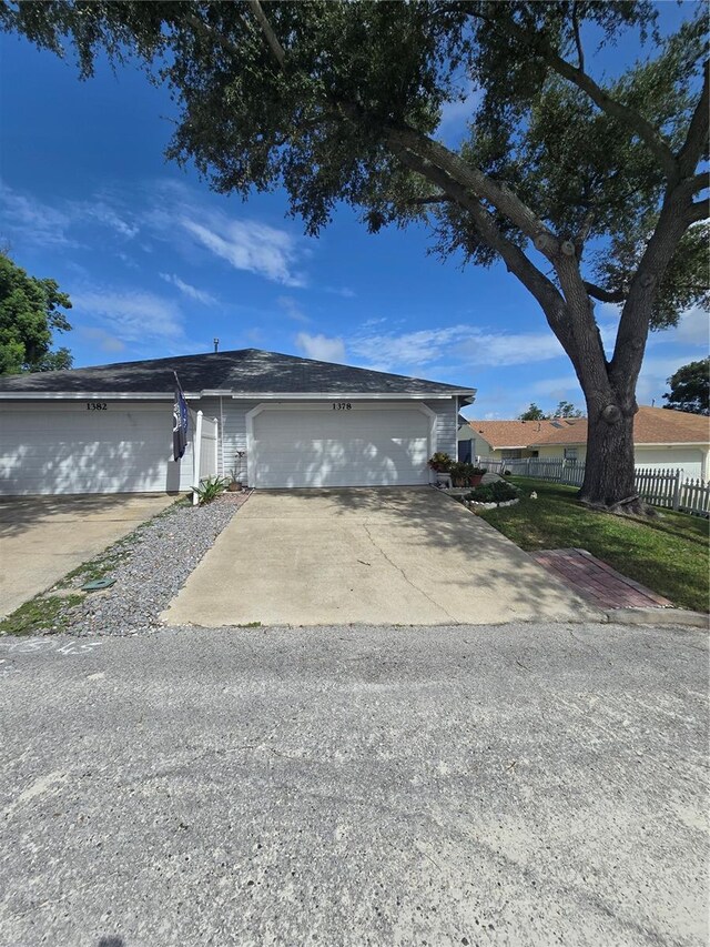 ranch-style house featuring a garage