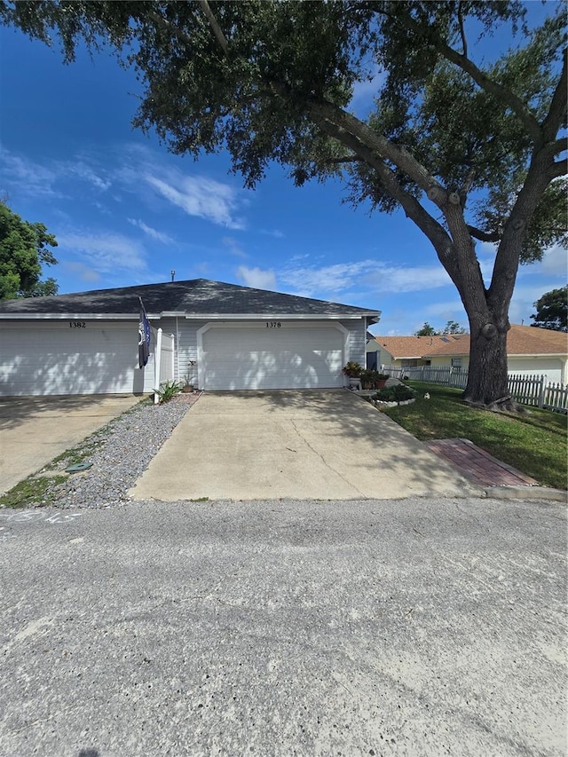 single story home with a garage