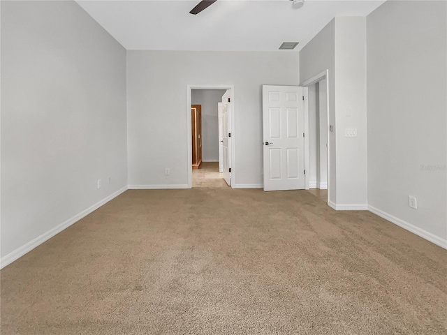 unfurnished bedroom with ceiling fan and light colored carpet