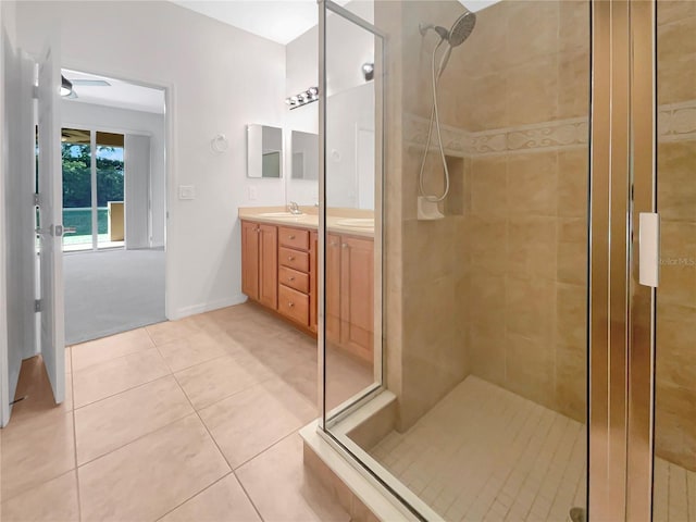 bathroom featuring vanity, an enclosed shower, and tile patterned floors