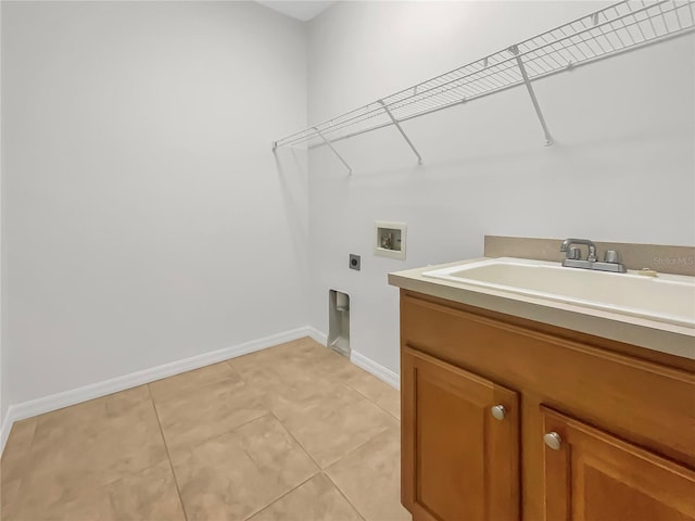 laundry room with light tile patterned flooring, sink, cabinets, washer hookup, and hookup for an electric dryer