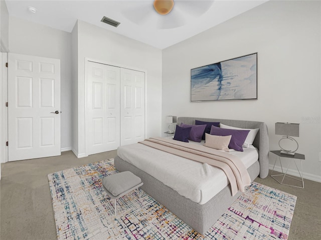 bedroom with ceiling fan, a closet, and carpet