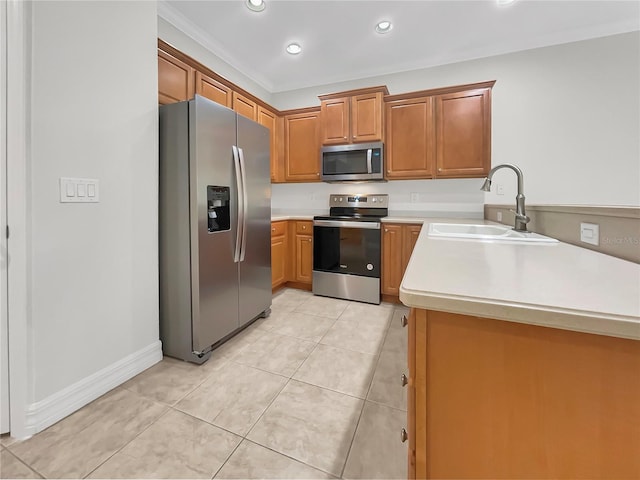 kitchen featuring sink, light tile patterned floors, stainless steel appliances, and kitchen peninsula