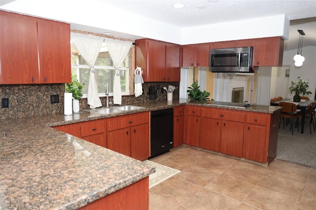 kitchen featuring black appliances, tasteful backsplash, sink, kitchen peninsula, and pendant lighting