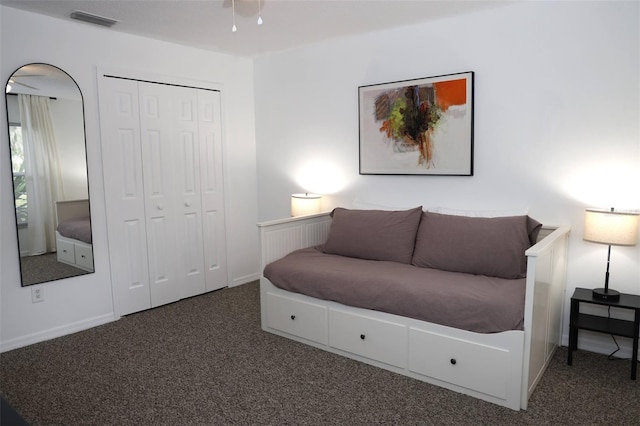 carpeted bedroom with a closet