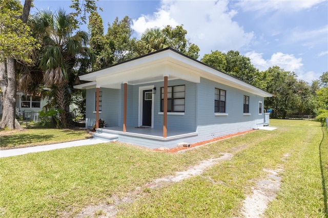 exterior space featuring a yard and covered porch