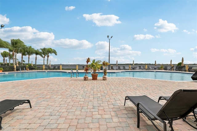 view of swimming pool with a patio