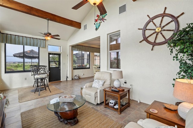 living room featuring ceiling fan, light tile patterned flooring, beam ceiling, and high vaulted ceiling