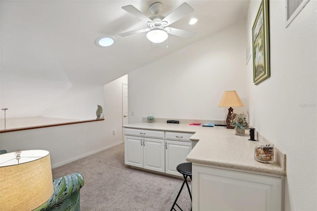 interior space featuring vaulted ceiling and ceiling fan