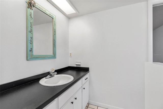 bathroom featuring tile patterned flooring and vanity