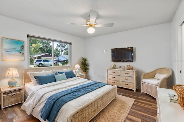 bedroom featuring dark wood-type flooring and ceiling fan