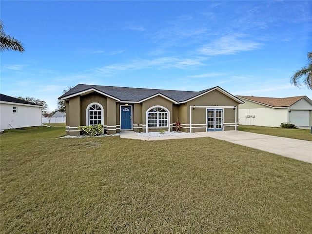 ranch-style house featuring a front lawn