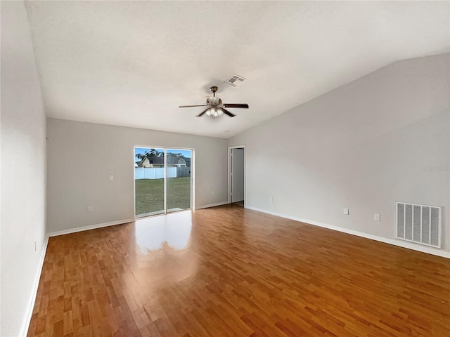 unfurnished room featuring ceiling fan, lofted ceiling, and hardwood / wood-style flooring