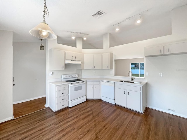 kitchen featuring white appliances, sink, decorative light fixtures, white cabinets, and lofted ceiling