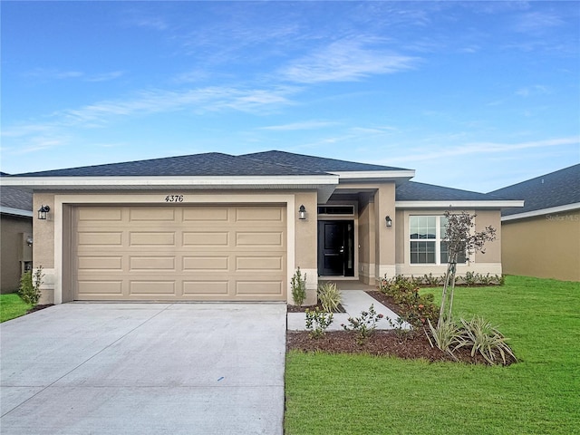 view of front of home featuring a garage, driveway, stucco siding, roof with shingles, and a front yard