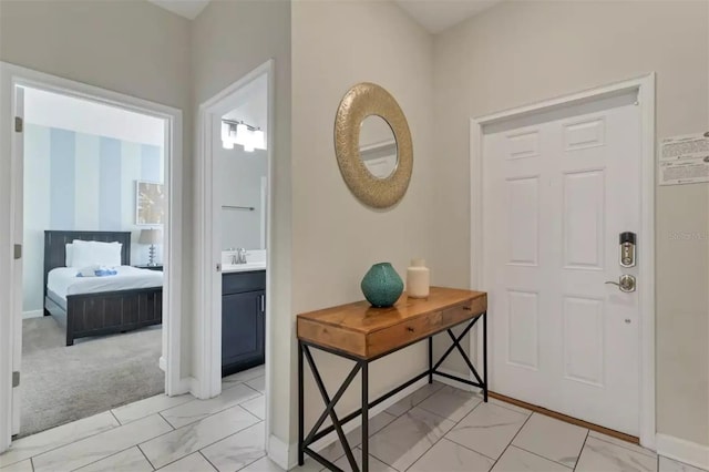 tiled foyer with sink