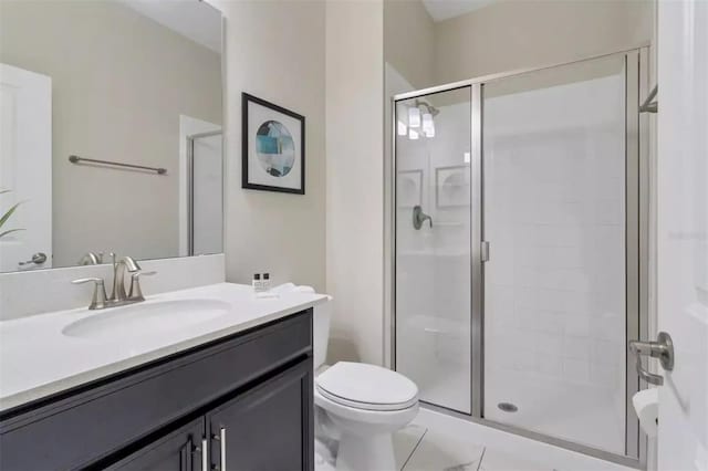 bathroom with walk in shower, tile patterned floors, toilet, and vanity