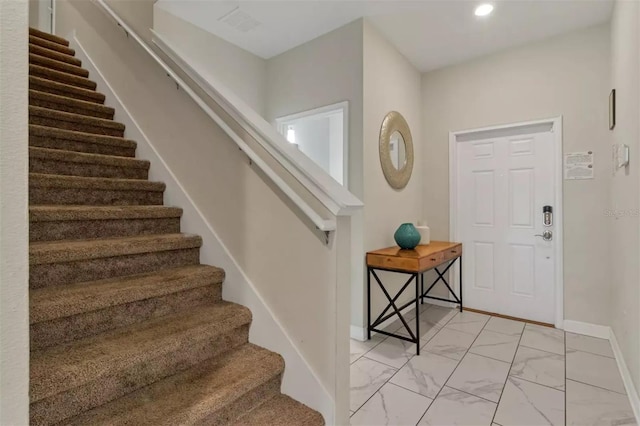 entrance foyer with baseboards, recessed lighting, stairs, and marble finish floor