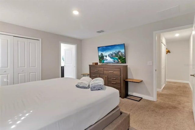 bedroom with recessed lighting, a closet, visible vents, baseboards, and light colored carpet