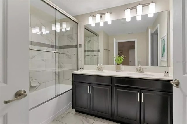 bathroom with double sink vanity, enclosed tub / shower combo, and tile patterned flooring