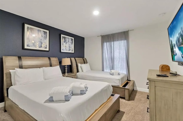 bedroom featuring light colored carpet