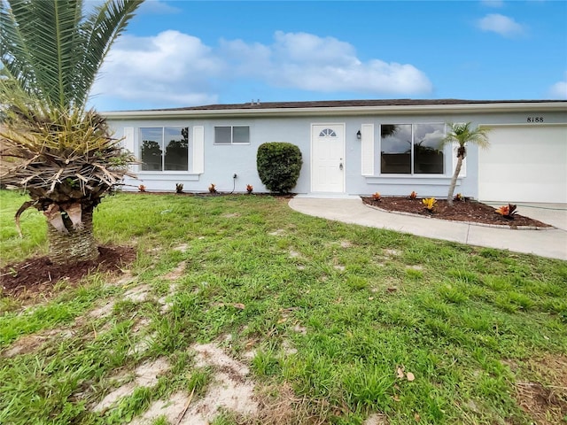 single story home featuring a front yard