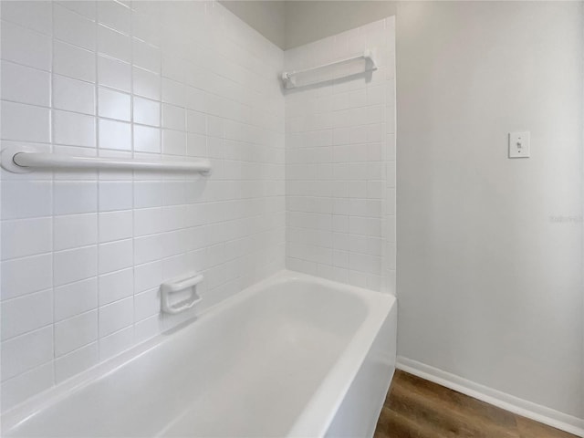 bathroom with hardwood / wood-style flooring and independent shower and bath