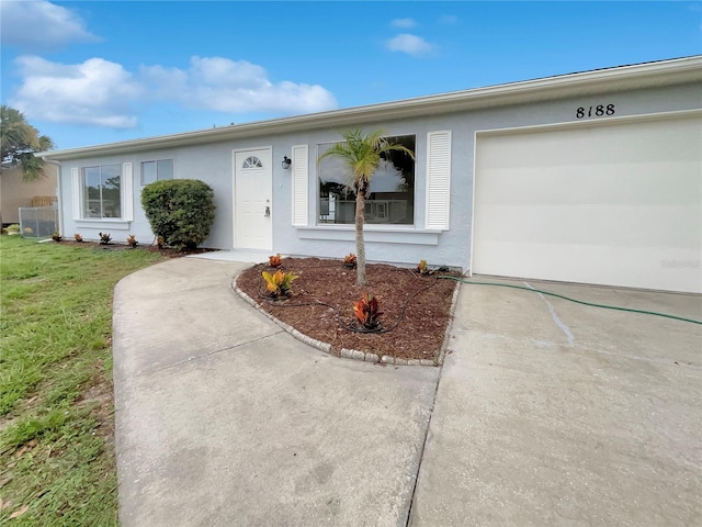 entrance to property featuring a garage