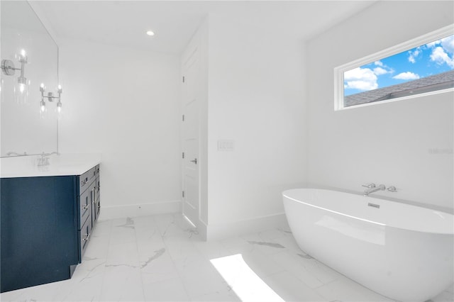 bathroom with vanity and a tub to relax in