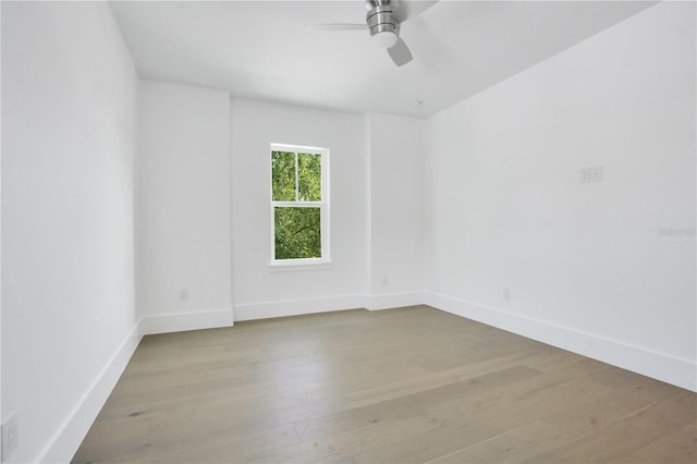 empty room featuring ceiling fan and light wood-type flooring