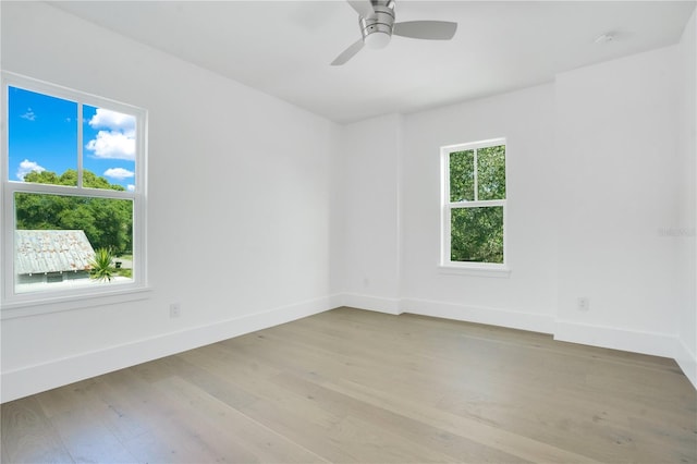 spare room with light hardwood / wood-style flooring and ceiling fan