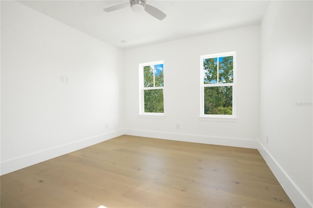 empty room featuring ceiling fan and light wood-type flooring