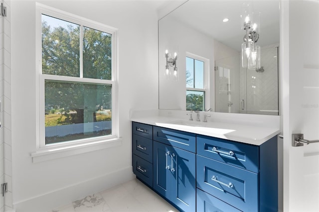 bathroom with vanity, a wealth of natural light, and an enclosed shower