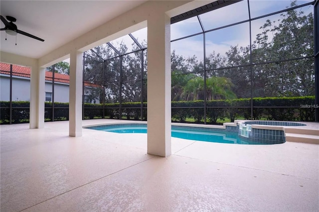 view of pool featuring an in ground hot tub, a patio, ceiling fan, and a lanai