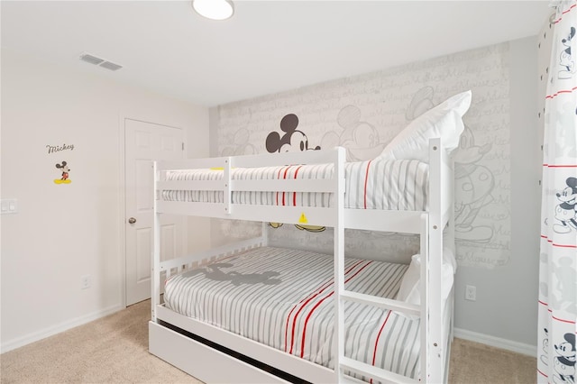 bedroom with light colored carpet