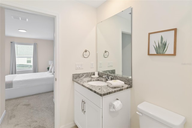 bathroom with vanity and toilet