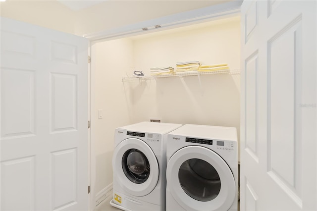 laundry room with separate washer and dryer