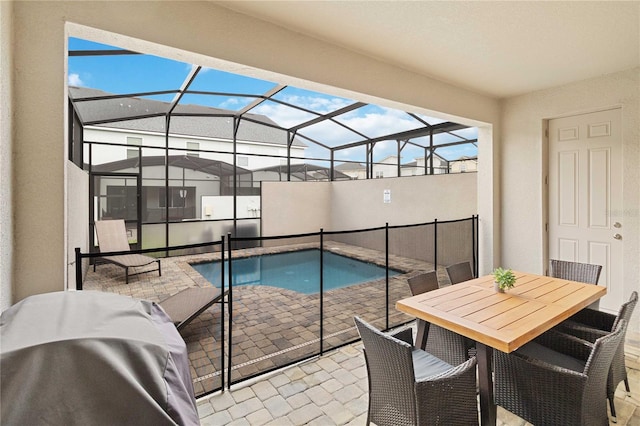 view of pool featuring a patio and glass enclosure