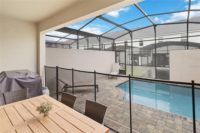 view of pool featuring a patio area and a lanai