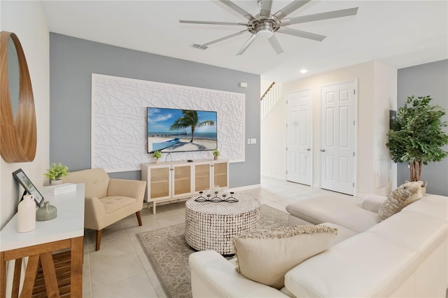 tiled living room featuring ceiling fan