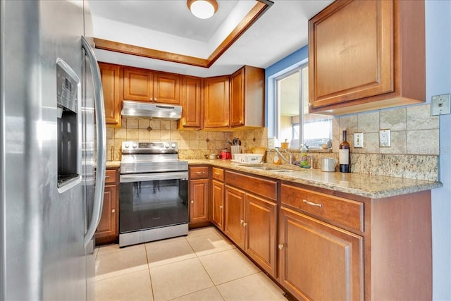 kitchen featuring sink, light tile patterned floors, stainless steel appliances, and backsplash