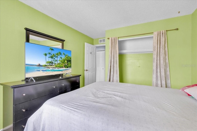 bedroom featuring a textured ceiling