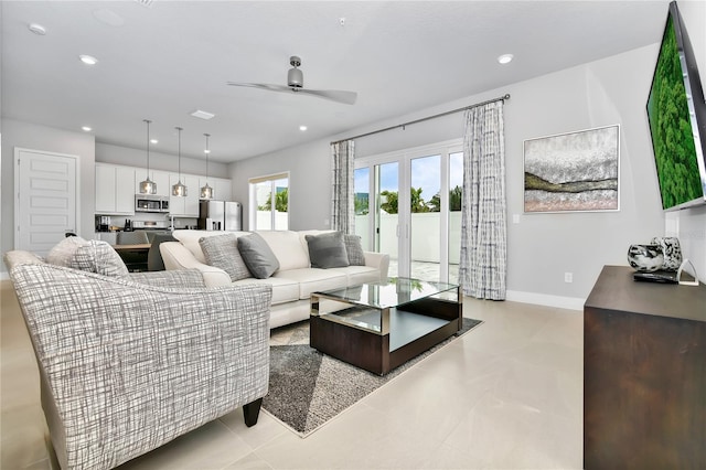 living room with light tile patterned floors and ceiling fan