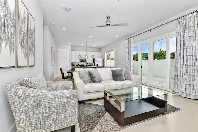 living room featuring visible vents, recessed lighting, baseboards, and a ceiling fan