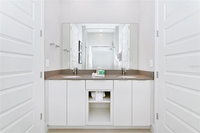 bathroom featuring dual vanity