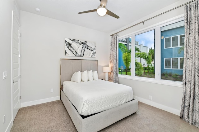 bedroom featuring ceiling fan and light colored carpet